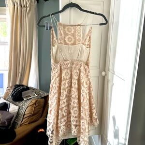 Beautiful Lacey dress. Asymmetrical above the knee.